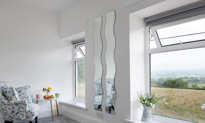 A cosy little space to sit and relax in the main bedroom